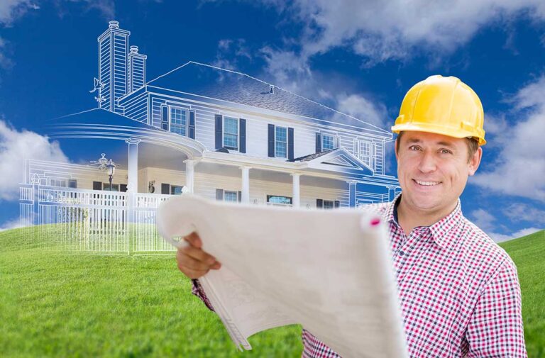 A couple reviews blueprints with a builder at a construction site, surrounded by materials and framework.